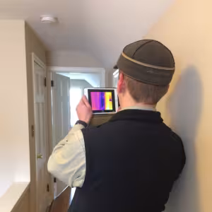 person testing heat in home