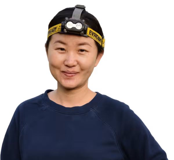 Person wearing a headlamp.