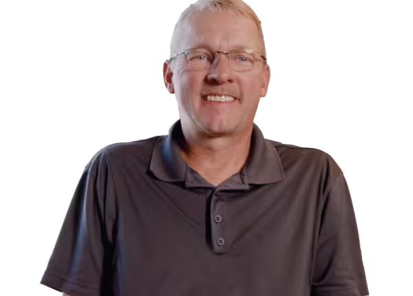 person in brown collared shirt smiling