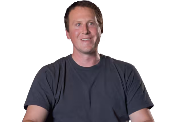 person in grey tshirt smiling