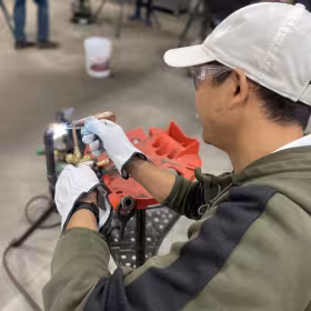 person welding